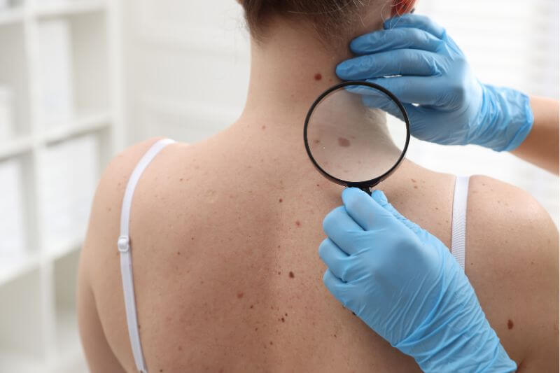 A woman receives a skin treatment from her dermatologist.